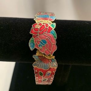 Pink, red, blue gold bracelet with flower/butterfly design